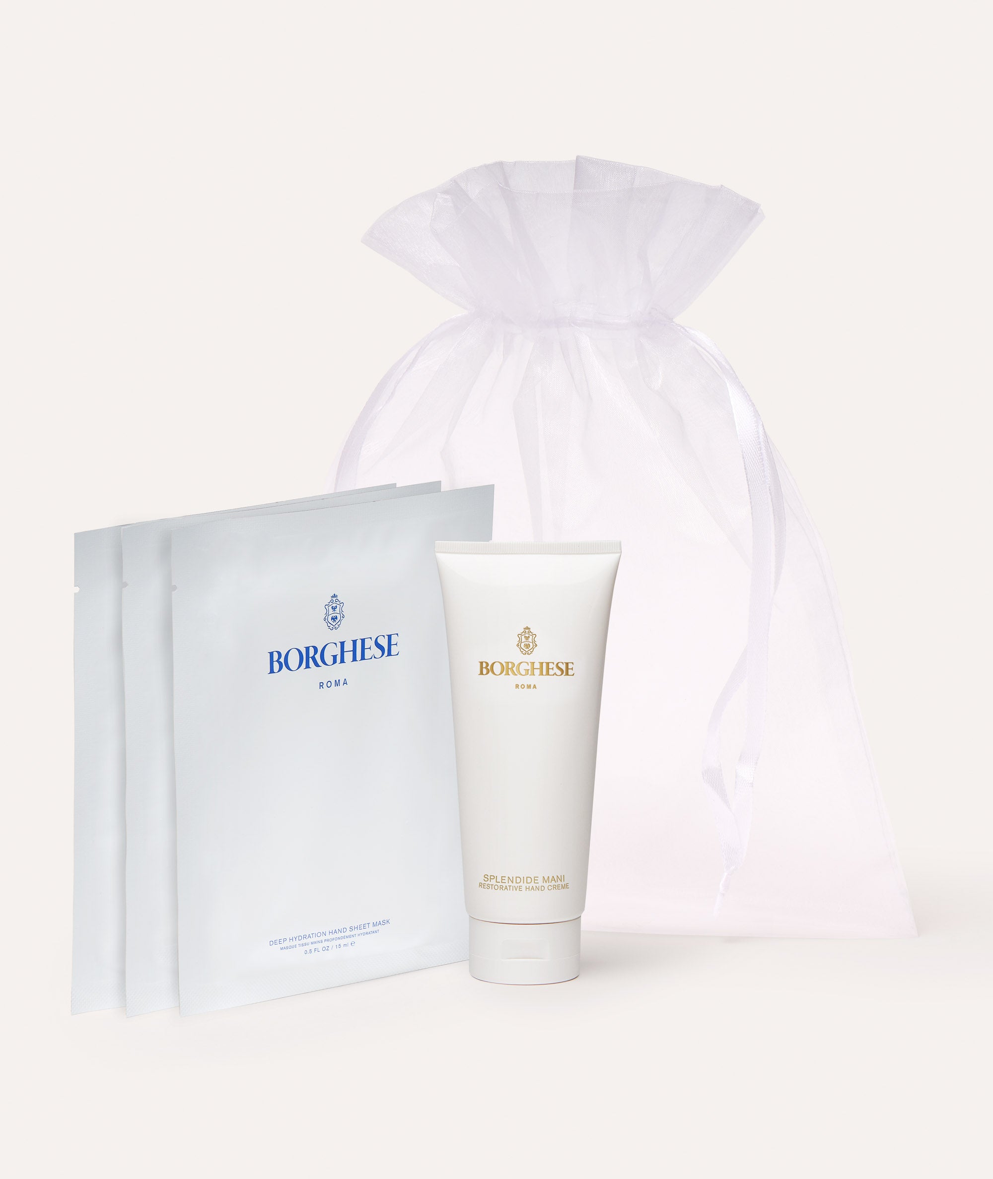 The Borghese Roma Hand Care Set includes a Splendide Mani Restorative Hand Creme and 3 Deep Hydration Hand Sheet Masks in a white organza bag