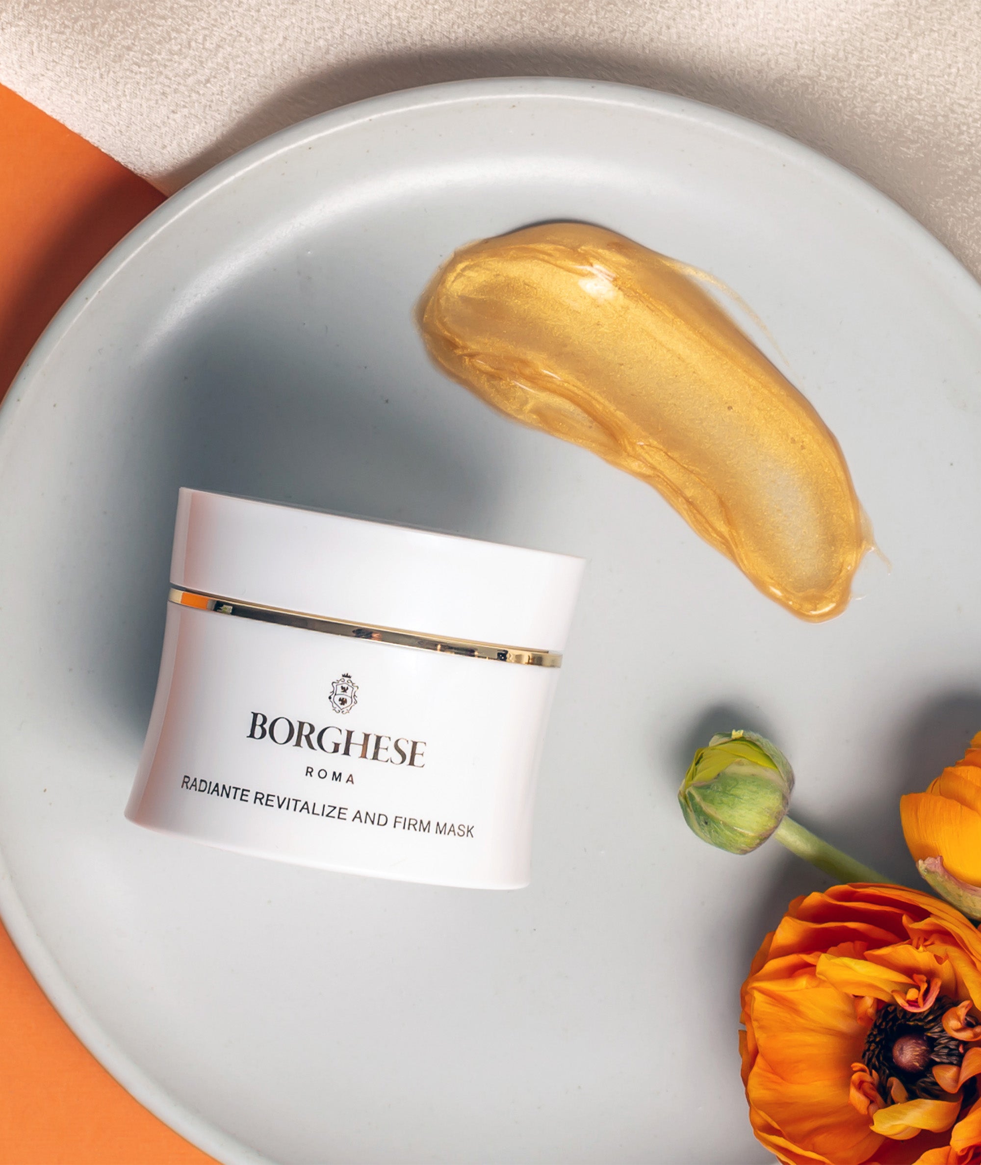 An overhead lifestyle shot of the Radiante Revitalize and Firm Mask  with a product swatch