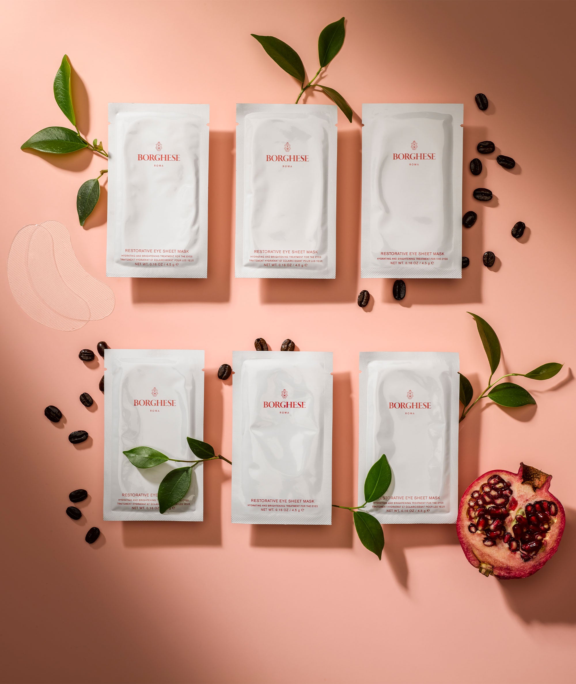 Flat lay of multiple eye sheet masks, showing the ingridients such as pomegranate extract