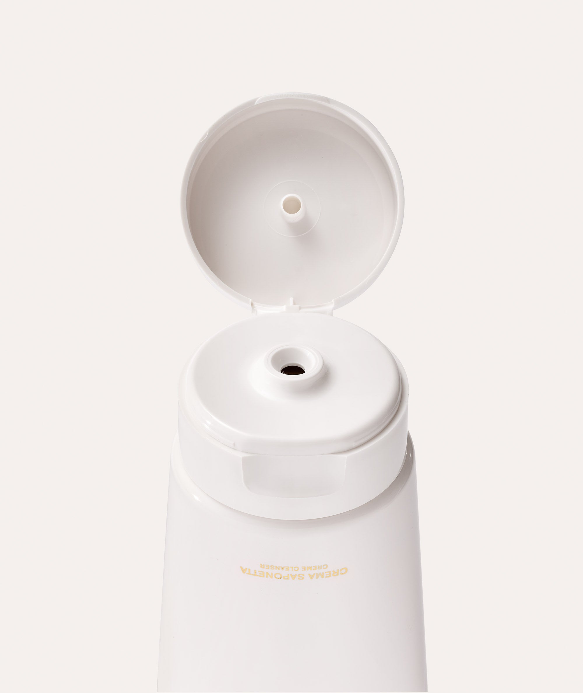 This is a picture of Borghese Crema Saponetta Creme Cleanser dispenser & cap