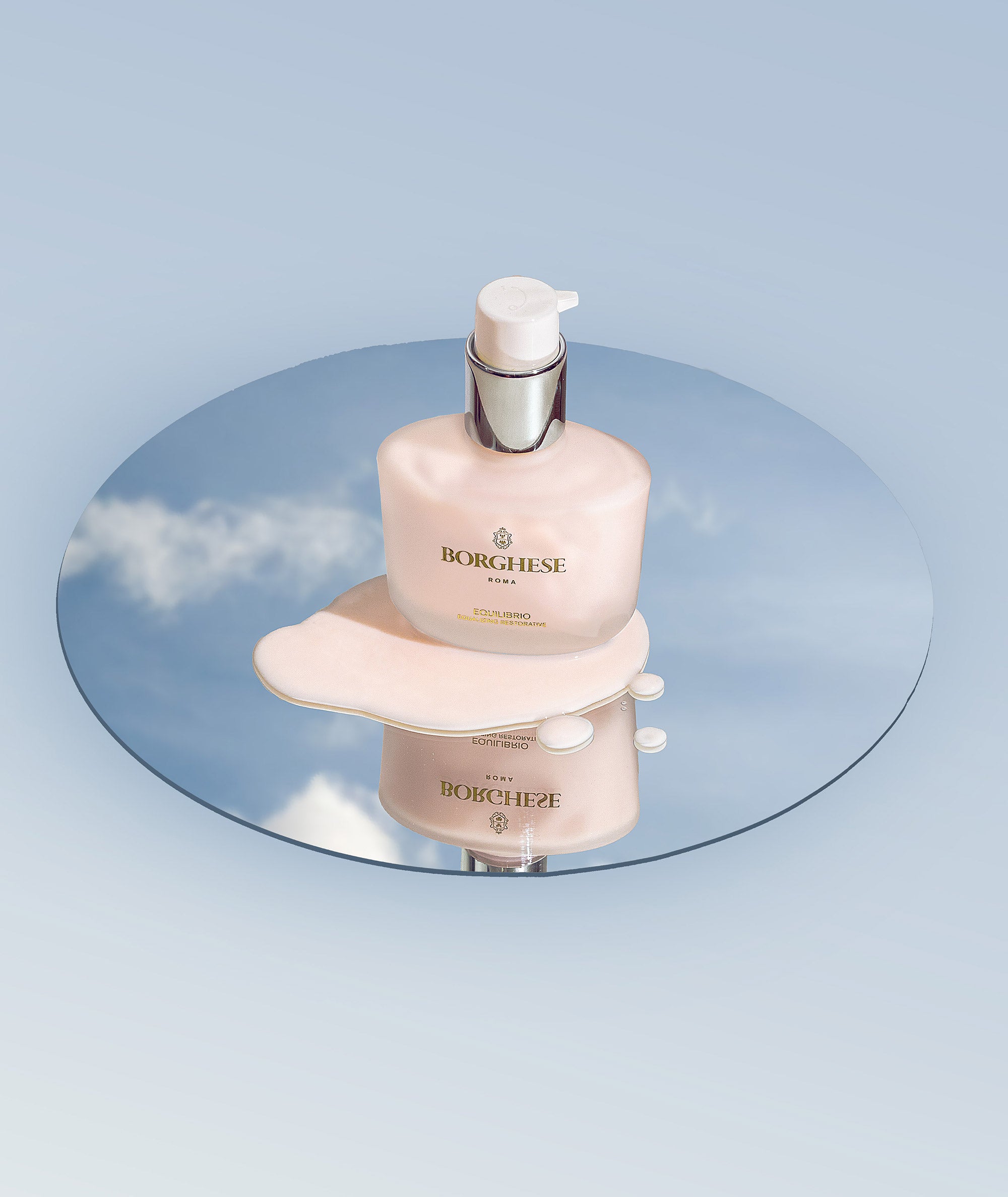 Product image of of Equilibrio Equalizing Restorative oil free moisturizer on a mirror reflecting the sky.