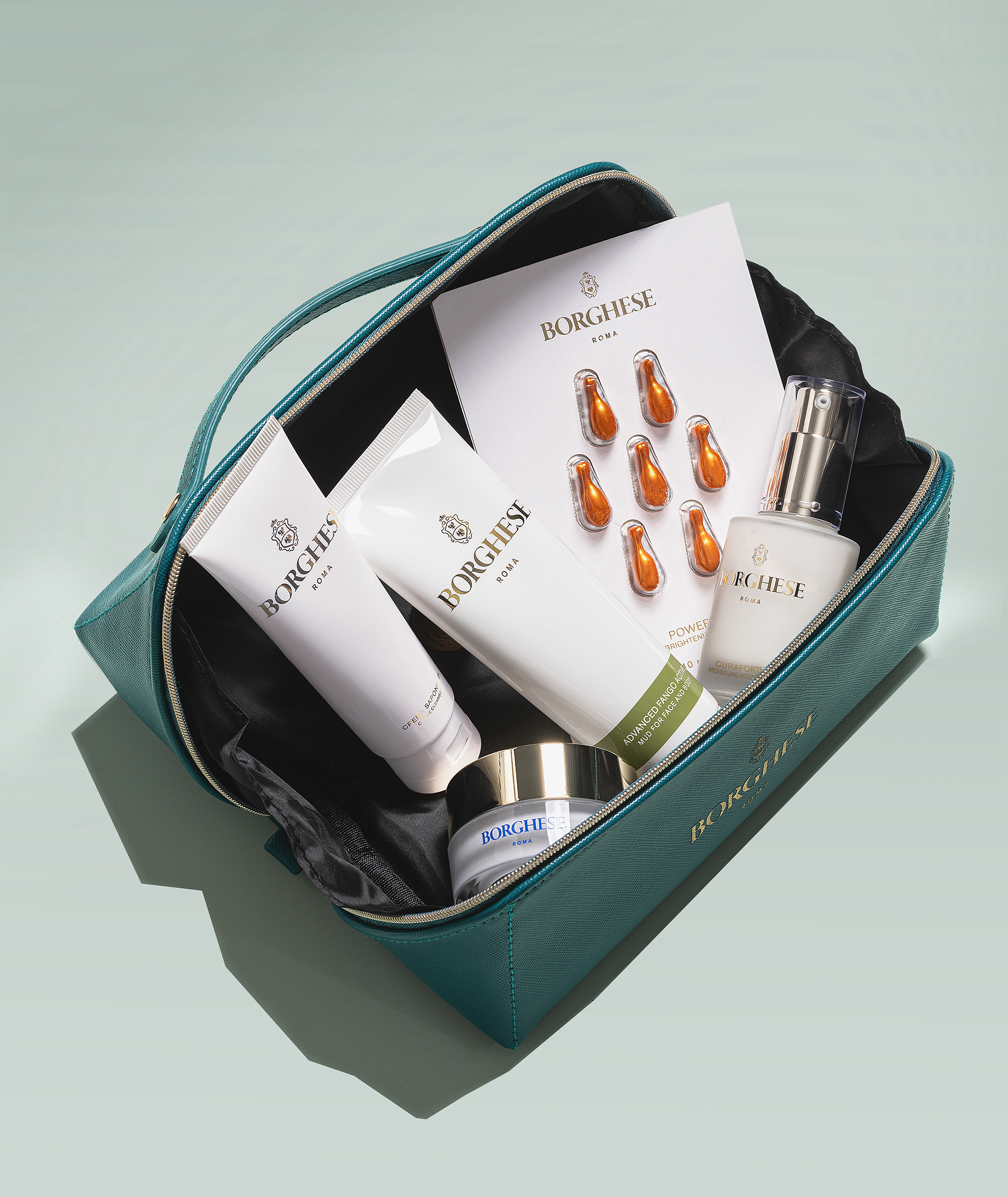 An overhead shot of the open bag in Bagno blue, that fits the Italian Recipe Travel Set