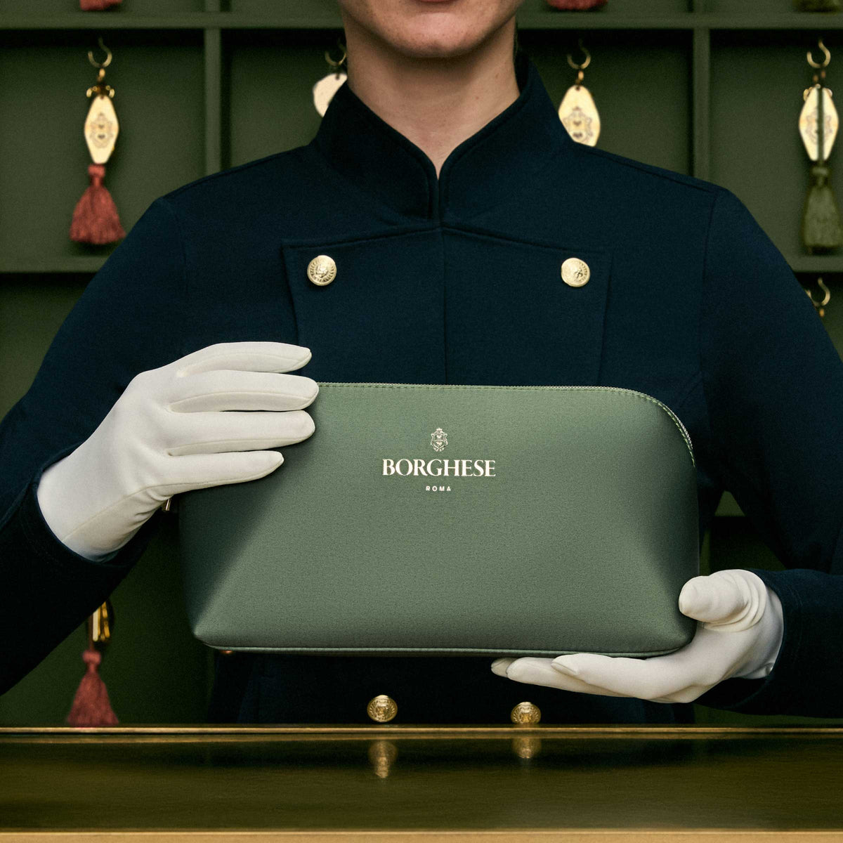 Borghese Concierge holding Radiant Ritual Set