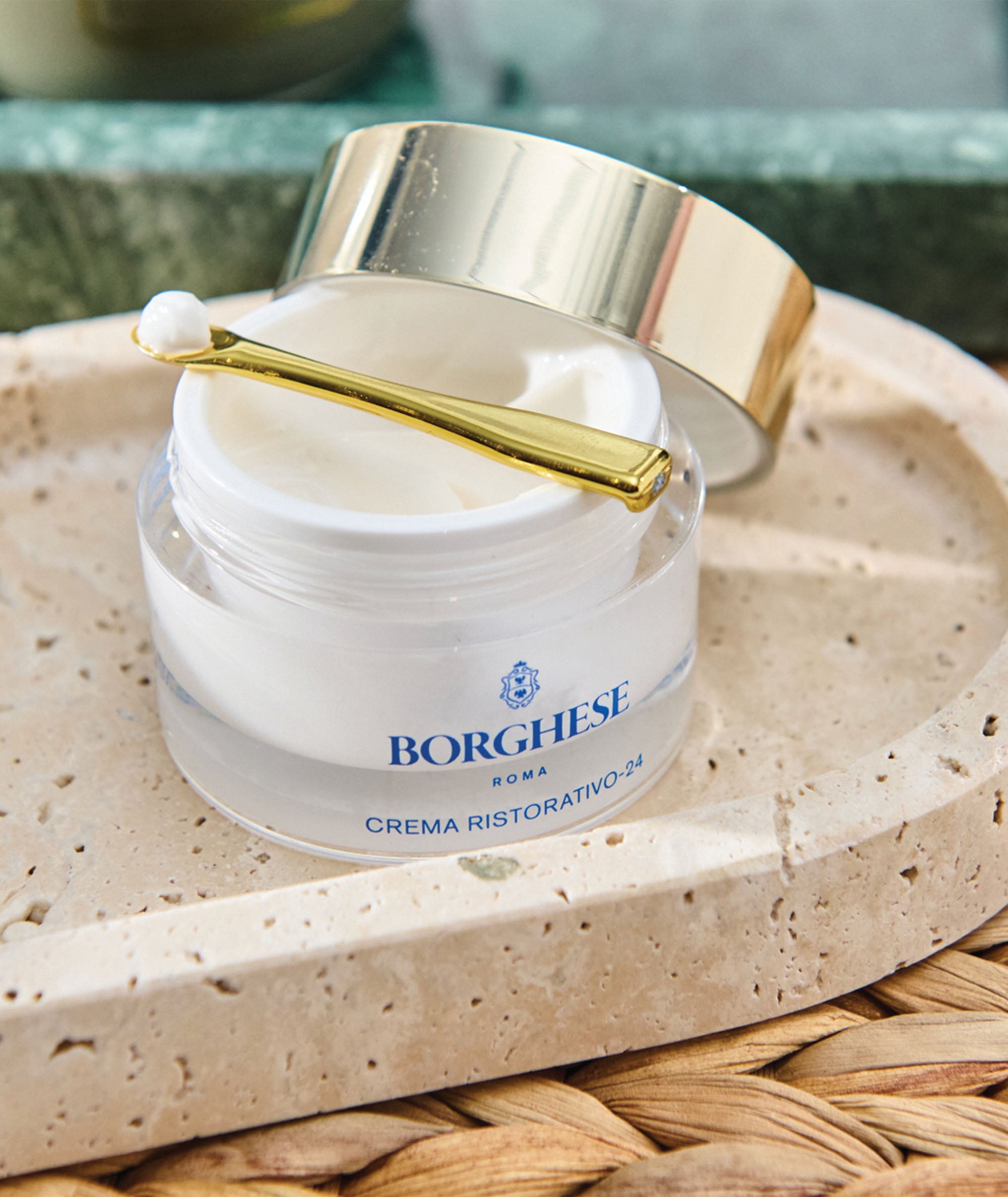 Lifestyle image of Crema Ristorativo-24 Moisturizer with the jar open