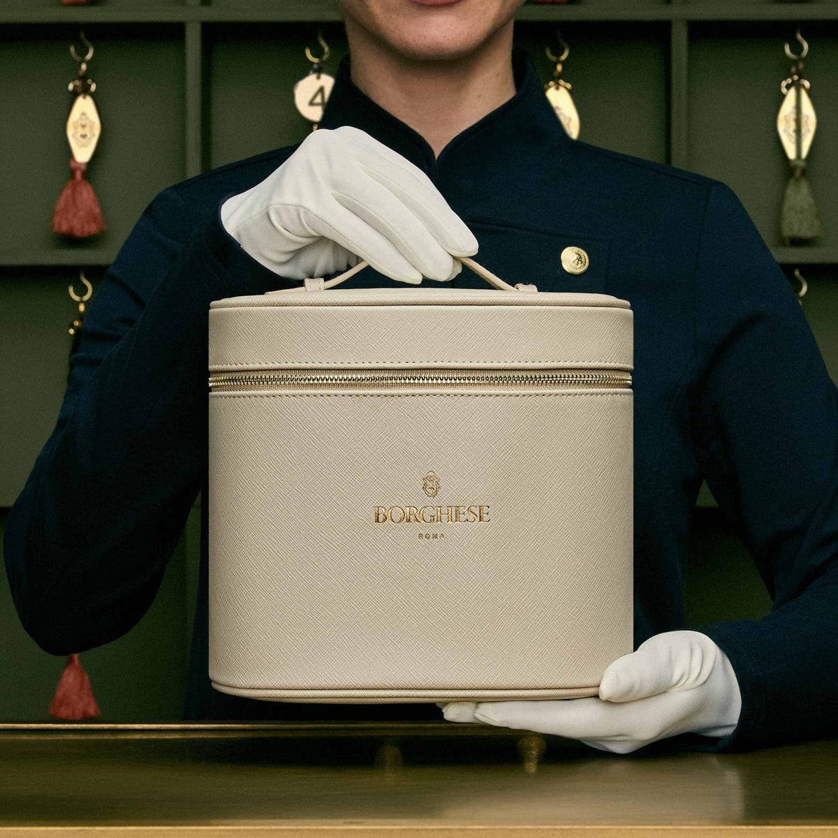 Borghese Concierge holding Tuscan Body Renewal Set